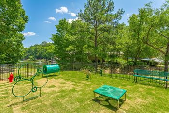 a park with a playground and a tennis court